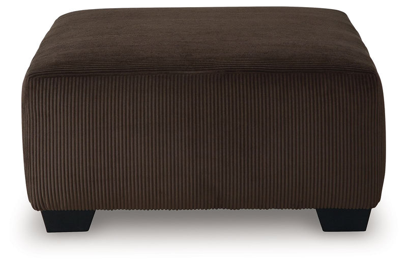 Kimlee - Sectional And Ottoman Set